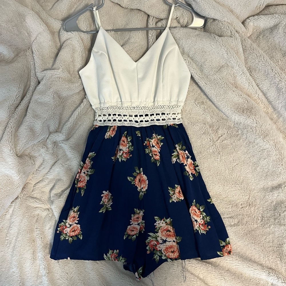 Blue and white romper with flowers